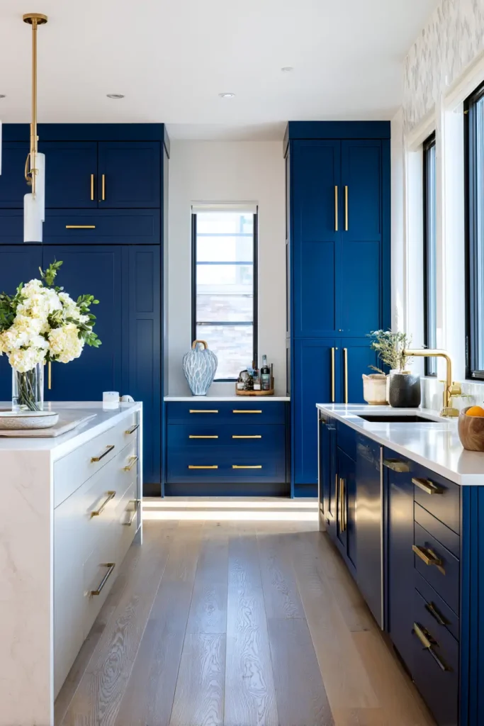 11. Pair Blue Cabinets with Gold for a Warm Finish