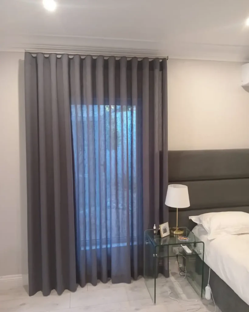 14. How Dark Curtains Add Contrast in Light Bedrooms